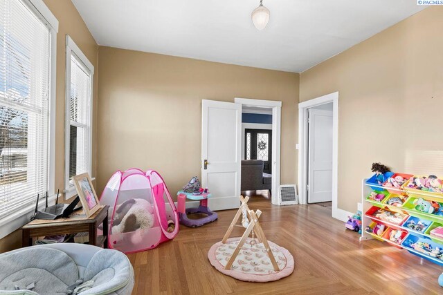 game room featuring parquet floors