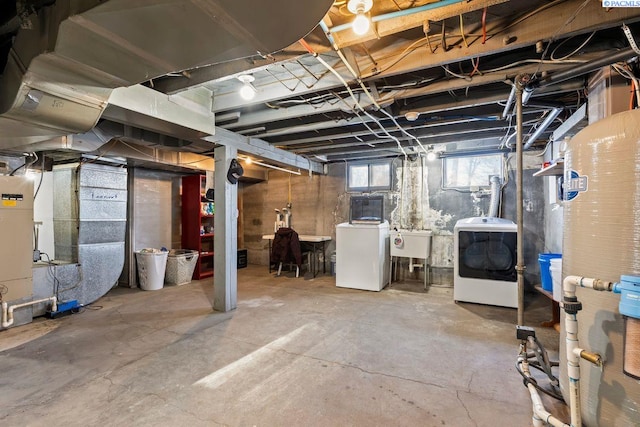 basement featuring sink and washing machine and dryer