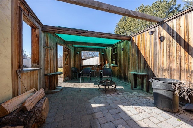 view of patio with a fire pit