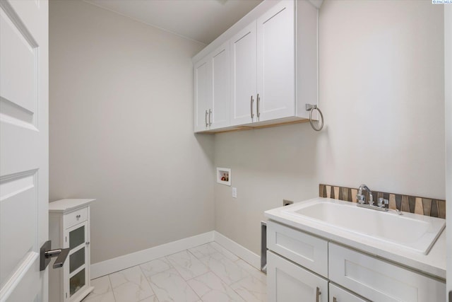 clothes washing area featuring cabinet space, baseboards, marble finish floor, washer hookup, and a sink