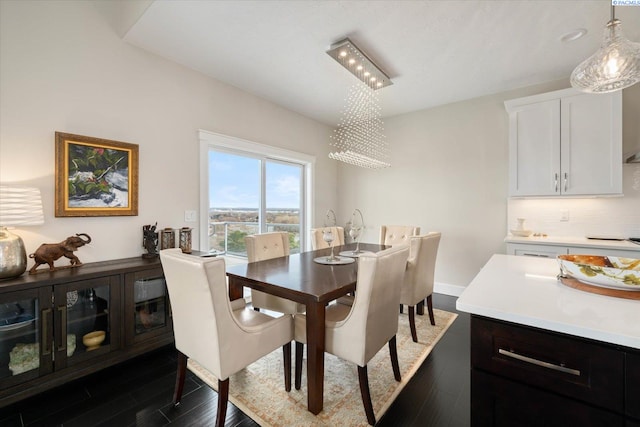 dining area with dark wood finished floors