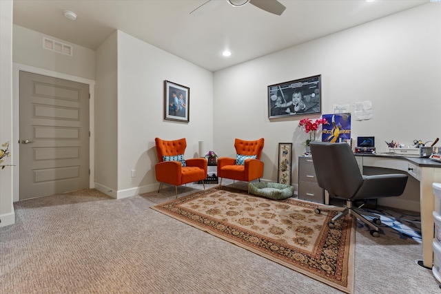 carpeted home office featuring ceiling fan