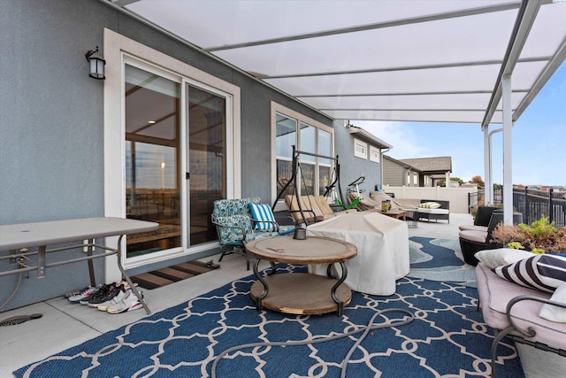 view of patio featuring an outdoor living space and a pergola