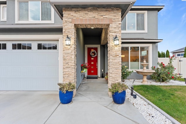 view of exterior entry with a garage