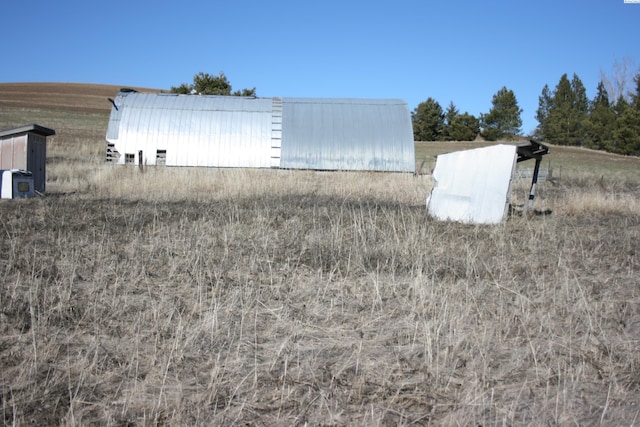 garage featuring a rural view