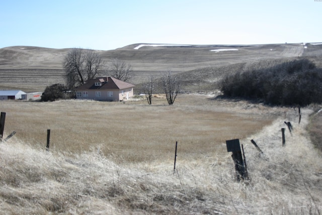 exterior space with a rural view