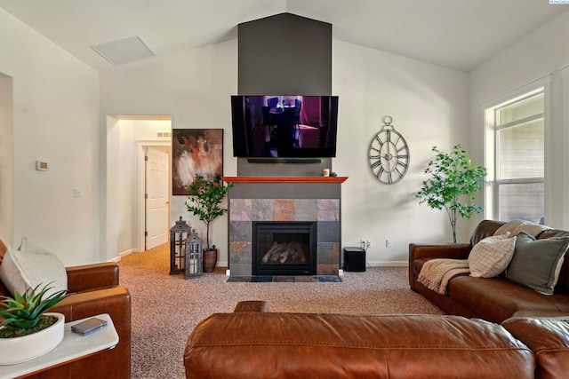 6117 Dorchester Ct, Pasco, WA 99301 - carpeted living room featuring lofted ceiling, a tile fireplace, and baseboards