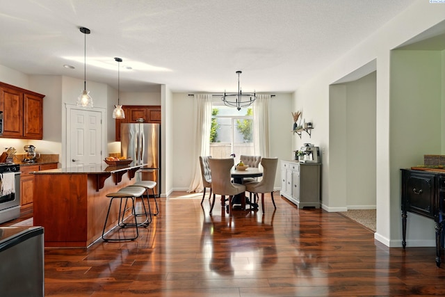 6117 Dorchester Ct, Pasco, WA 99301 - dining room featuring dark wood-type flooring and baseboards