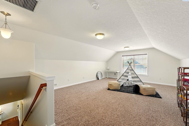 6117 Dorchester Ct, Pasco, WA 99301 - recreation room with lofted ceiling, carpet flooring, baseboards, and a textured ceiling