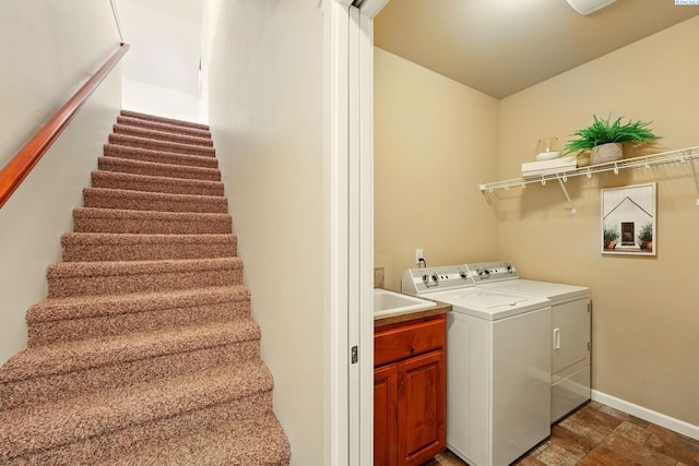 6117 Dorchester Ct, Pasco, WA 99301 - washroom with washer and dryer, stone finish floors, baseboards, and cabinet space