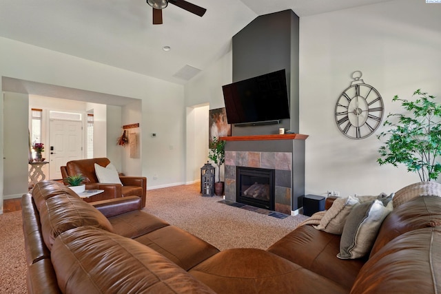 6117 Dorchester Ct, Pasco, WA 99301 - living area with ceiling fan, baseboards, carpet flooring, a tile fireplace, and high vaulted ceiling