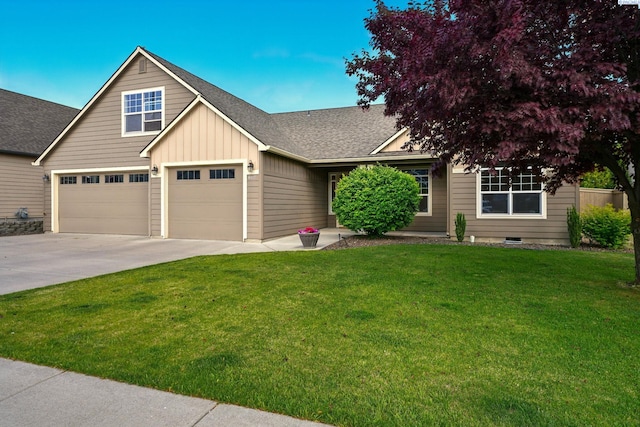 6117 Dorchester Ct, Pasco, WA 99301 - view of front facade with board and batten siding, driveway, a front yard, and a shingled roof