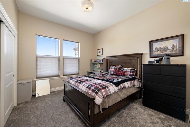 carpeted bedroom with baseboards
