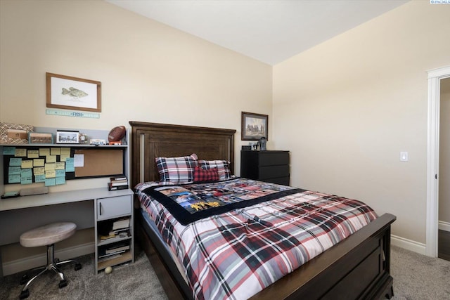 carpeted bedroom featuring baseboards