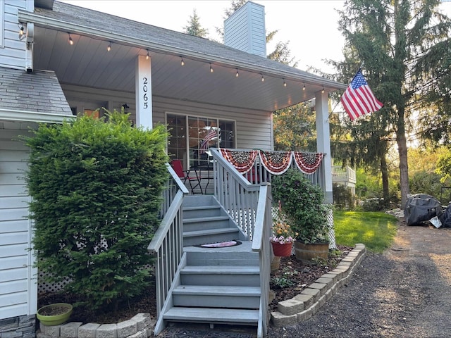 2065 NW Turner Dr, Pullman, WA 99163 - property entrance with a porch, a chimney, and a shingled roof