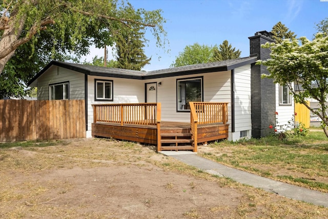 ranch-style house featuring a wooden deck