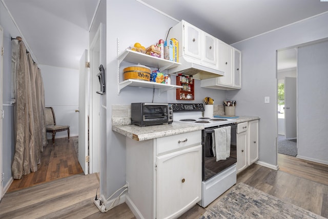 2017 Everest Ave, Richland, WA 99354 - kitchen featuring white electric range, wood finished floors, white cabinets, and premium range hood