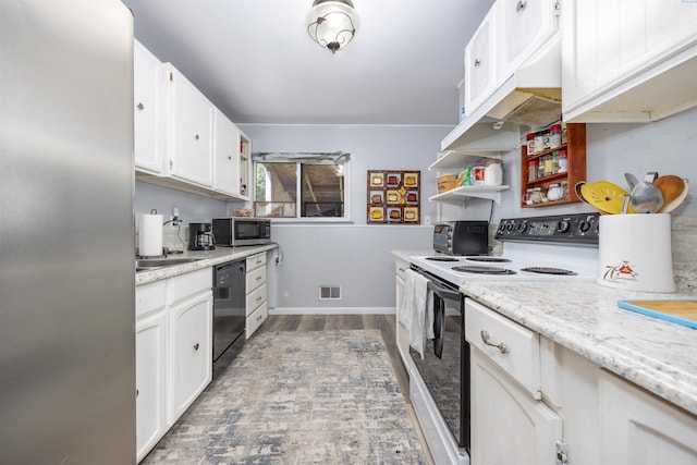 2017 Everest Ave, Richland, WA 99354 - kitchen with stainless steel appliances, white cabinetry, wood finished floors, open shelves, and light stone counters