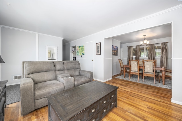 2017 Everest Ave, Richland, WA 99354 - living area featuring a chandelier, light wood-style floors, and crown molding