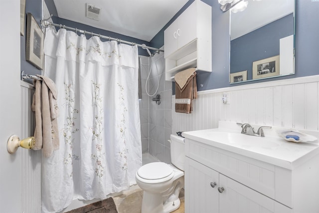2017 Everest Ave, Richland, WA 99354 - full bathroom with vanity, a wainscoted wall, and a tile shower