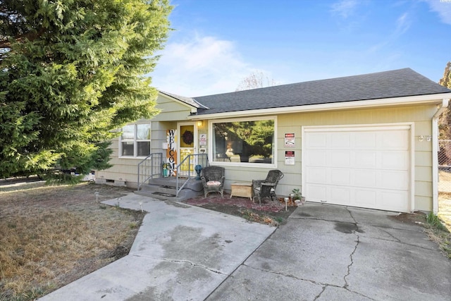 ranch-style home featuring a garage