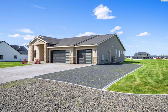 view of front of home with concrete driveway, stucco siding, stone siding, an attached garage, and a front lawn