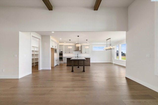 living room with beamed ceiling, recessed lighting, and dark wood-style floors