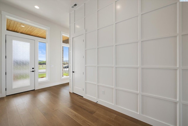 doorway to outside with baseboards, dark wood-style floors, visible vents, and recessed lighting