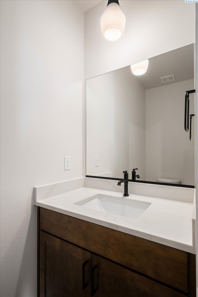 bathroom featuring visible vents and vanity