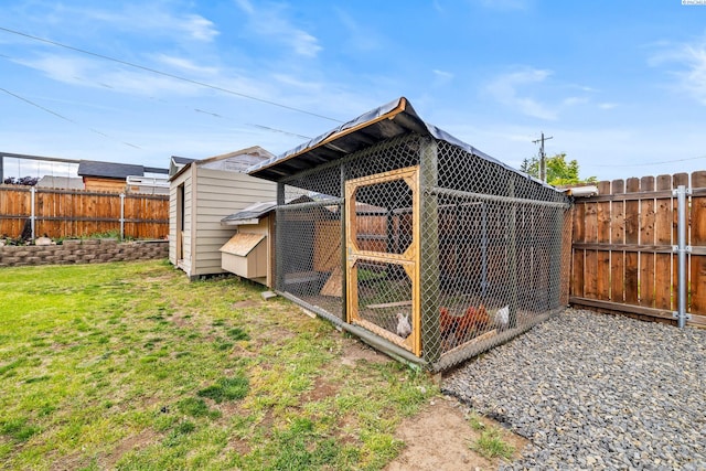 view of poultry coop featuring a fenced backyard