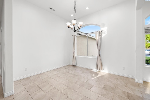 unfurnished dining area featuring a chandelier, recessed lighting, light tile patterned floors, and baseboards