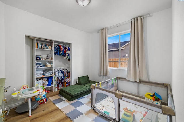 rec room featuring wood finished floors