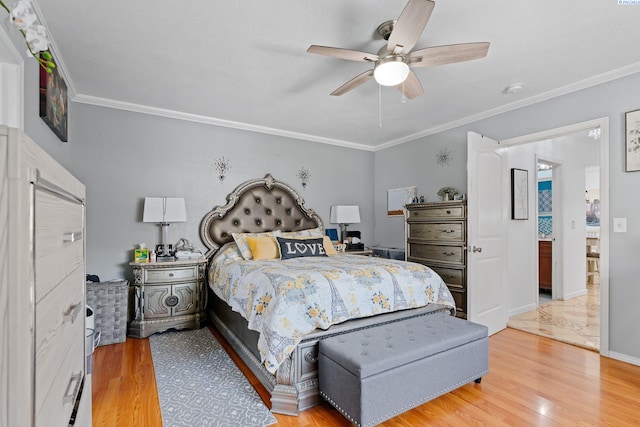 bedroom featuring ornamental molding, light wood-style flooring, and ceiling fan