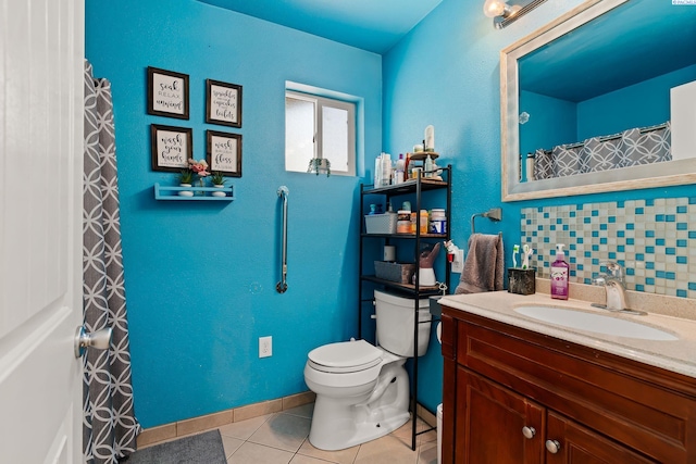 full bath featuring tile patterned flooring, baseboards, toilet, and vanity