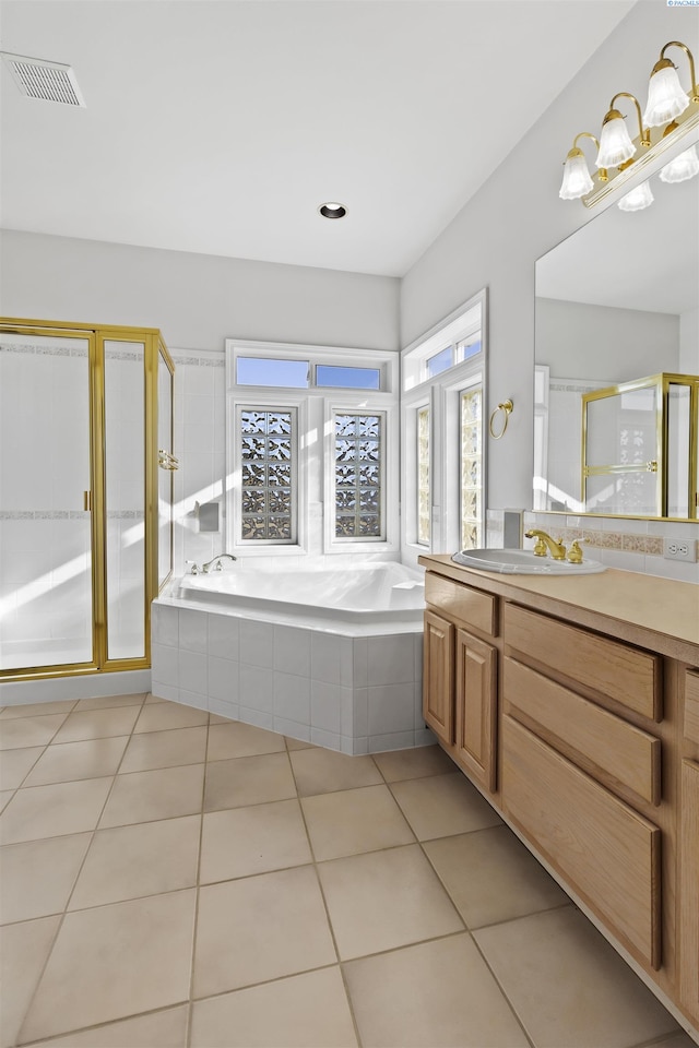 bathroom with tile patterned floors, plus walk in shower, and vanity