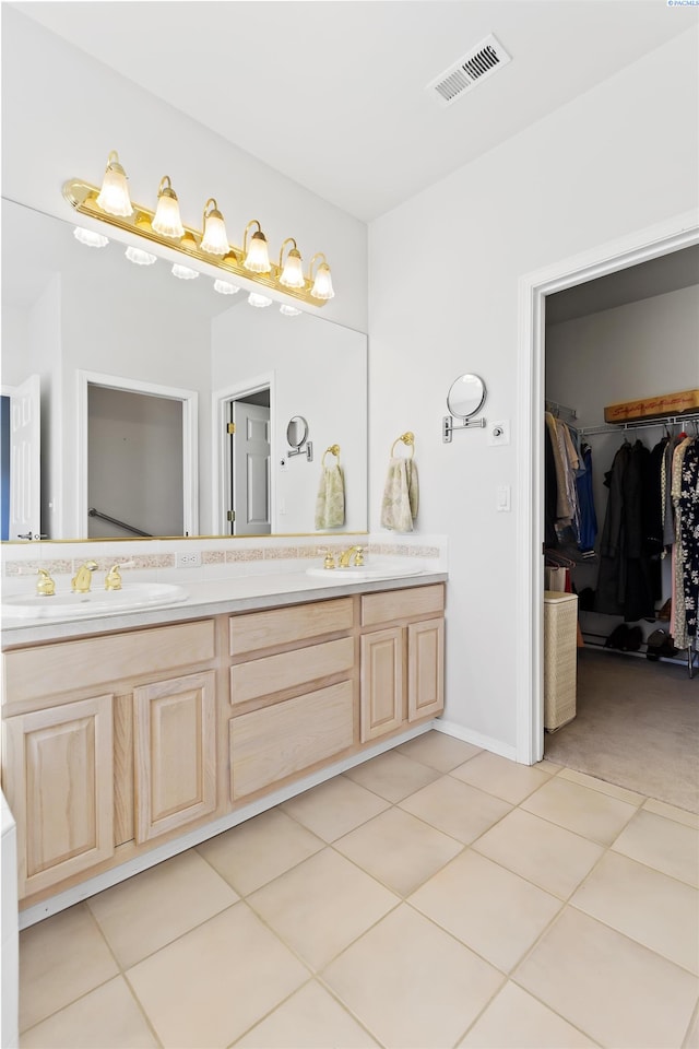 bathroom featuring vanity and tile patterned flooring