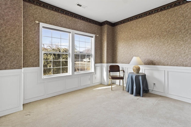 unfurnished room featuring light carpet