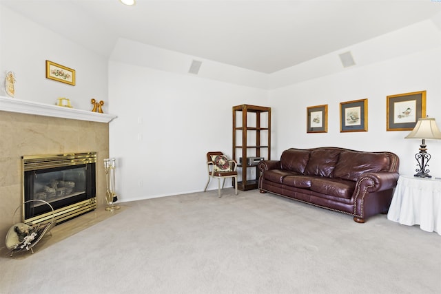 living room featuring carpet flooring and a fireplace