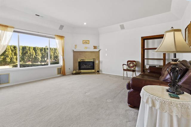 carpeted living room featuring a fireplace