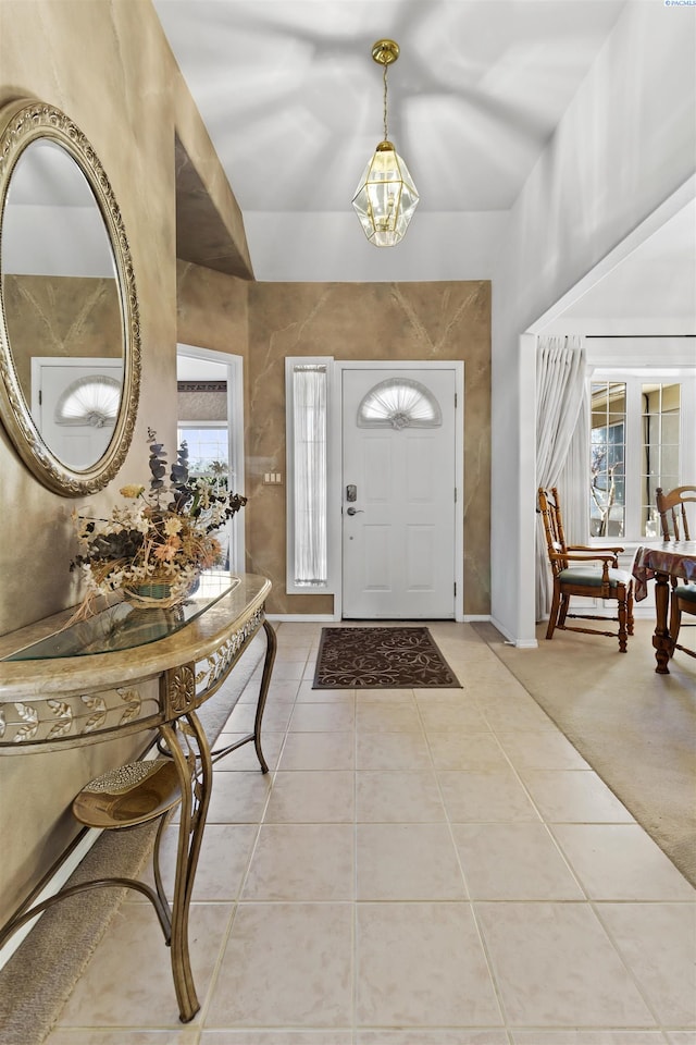 entryway with light tile patterned flooring