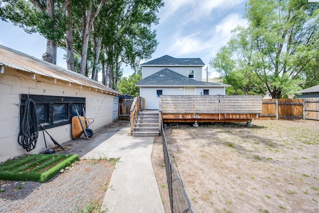 1804 Cedar St, Colfax, WA 99111 - back of house with a deck, a fenced backyard, and concrete block siding