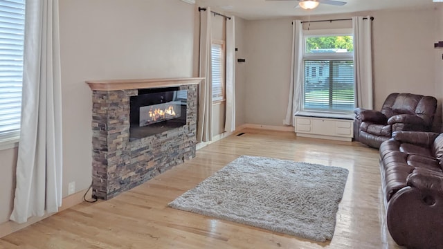 1804 Cedar St, Colfax, WA 99111 - living area with ceiling fan, a fireplace, and light wood-style floors
