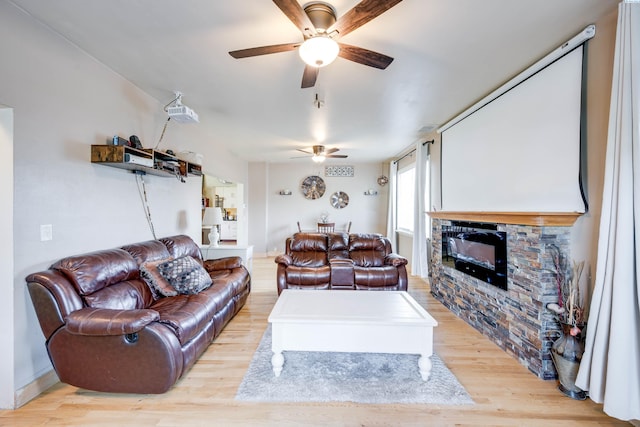 1804 Cedar St, Colfax, WA 99111 - living area with ceiling fan, light wood finished floors, and a stone fireplace