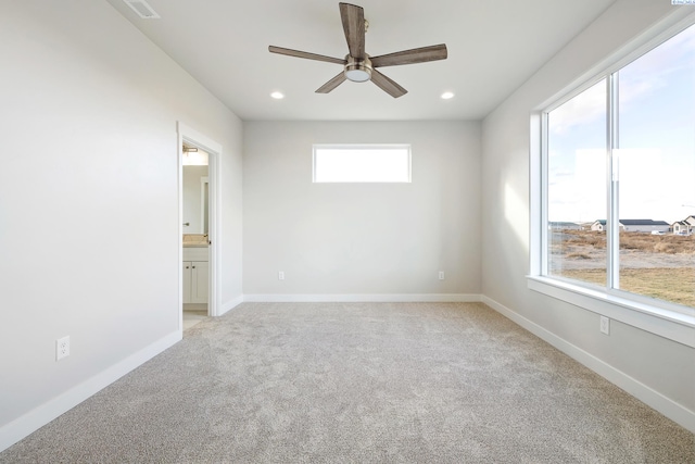 carpeted empty room with ceiling fan