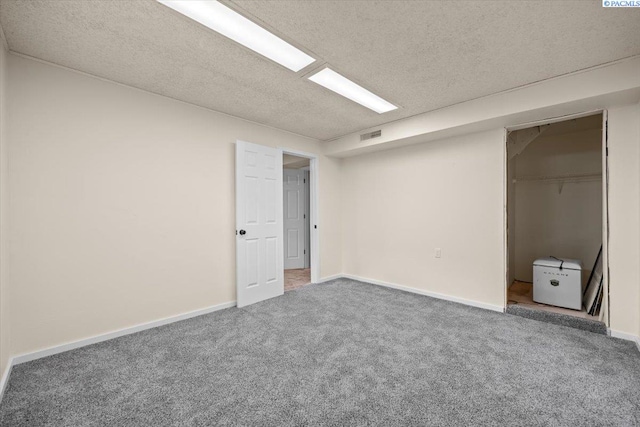 1807 Stevens Dr, Richland, WA 99354 - unfurnished bedroom featuring carpet floors, a textured ceiling, and baseboards
