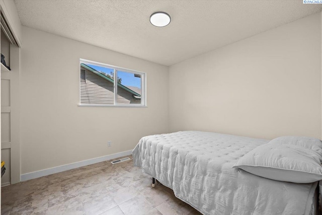 1807 Stevens Dr, Richland, WA 99354 - bedroom featuring baseboards and a textured ceiling