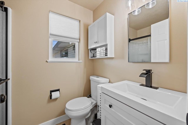 1807 Stevens Dr, Richland, WA 99354 - bathroom with toilet, vanity, a shower, and baseboards