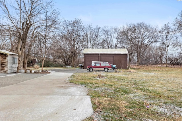 view of street with concrete driveway