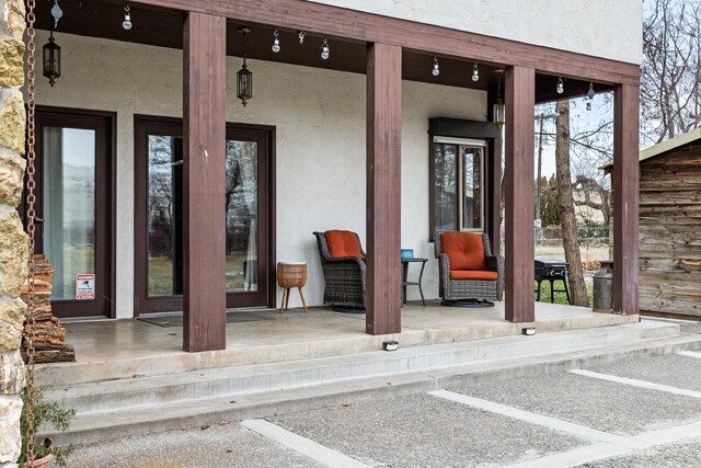 view of exterior entry featuring stucco siding