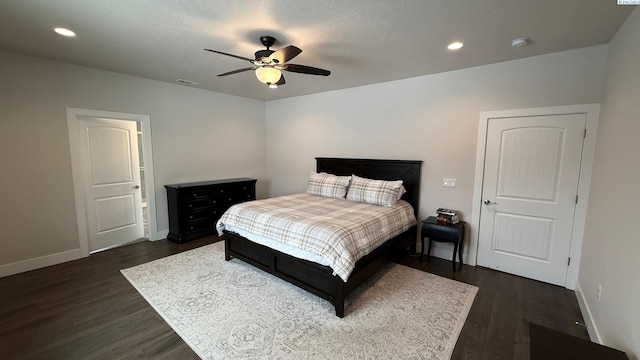 bedroom with dark wood-type flooring, recessed lighting, visible vents, and baseboards